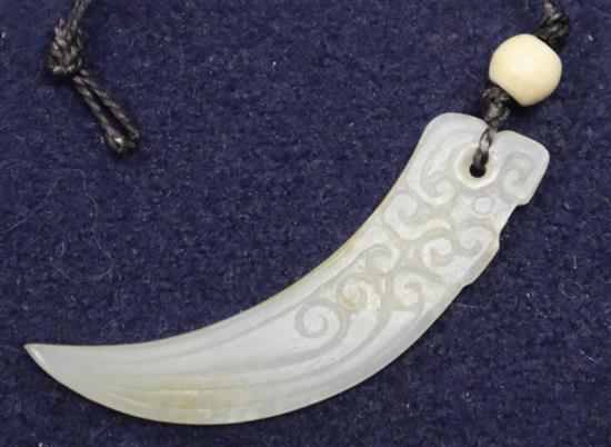 A jade tooth pendant